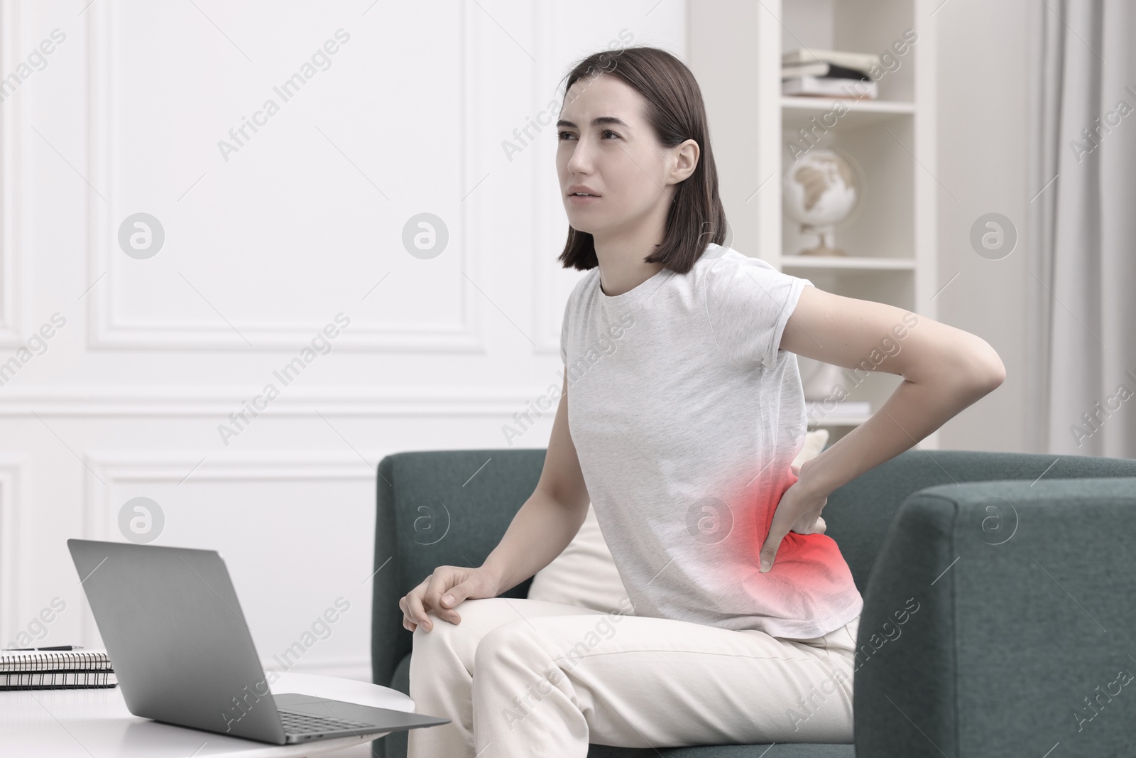 Image of Woman suffering from backache due to poor posture and uncomfortable workplace