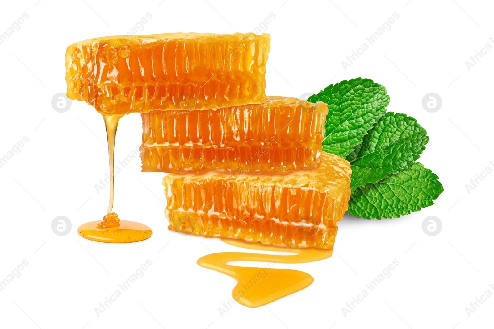 Image of Honey dripping from honeycomb pieces isolated on white