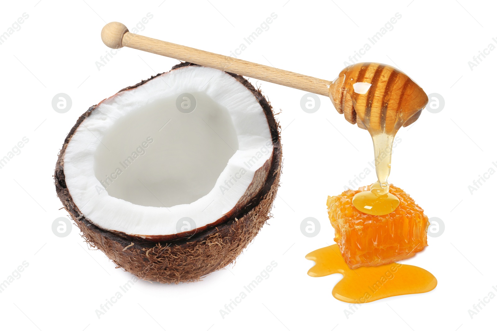 Image of Coconut, wooden dipper with honey and honeycomb isolated on white