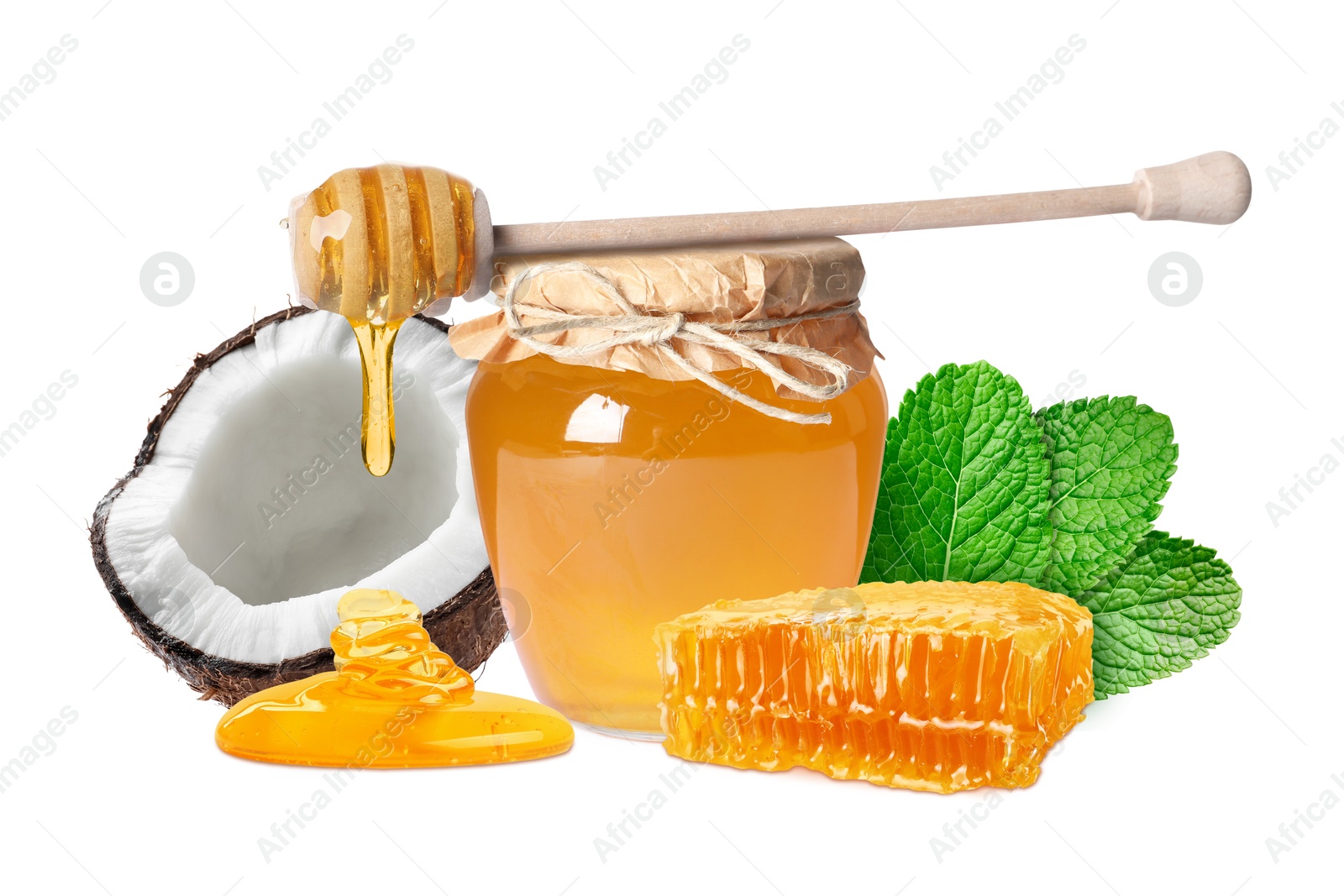 Image of Coconut, honeycomb, wooden dipper and jar with honey and isolated on white