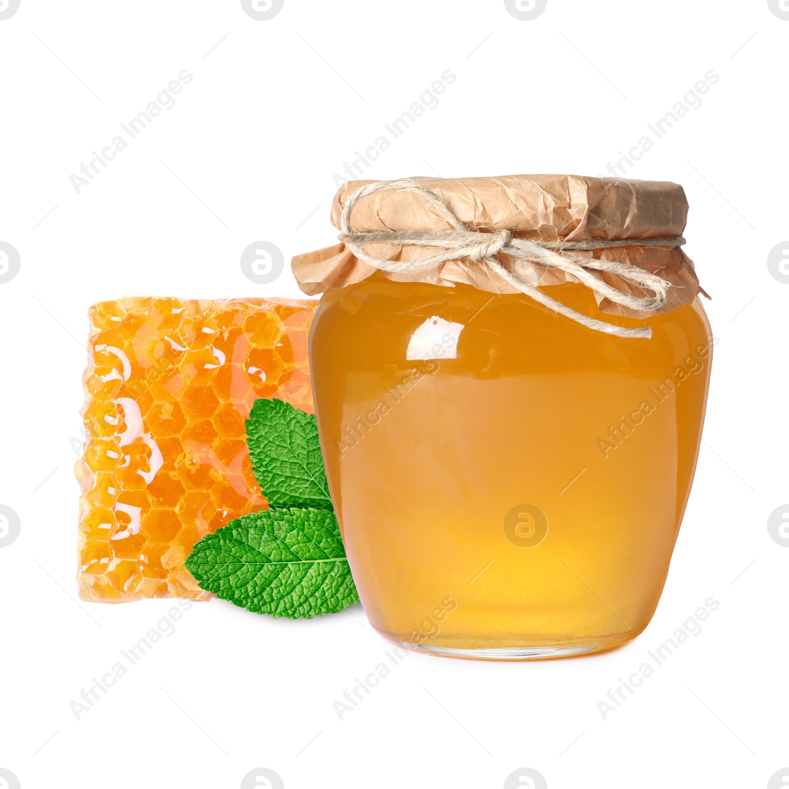 Image of Jar with honey, green leaves and honeycomb isolated on white