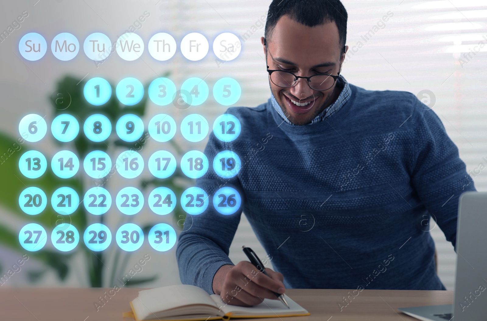 Image of Making timetable. Man writing in notebook at table and virtual calendar near him