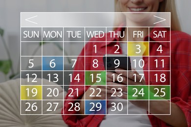Image of Woman making timetable in mobile phone. Virtual calendar with marked dates in foreground