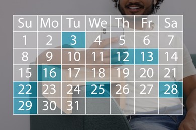 Image of Man making timetable in phone, closeup. Virtual calendar with marked dates in foreground