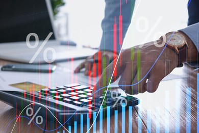 Image of Budget concept. Graphs and man using calculator at table, double exposure