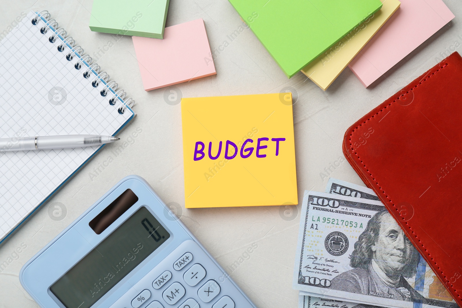 Image of Note with word Budget, calculator and money on white table, flat lay