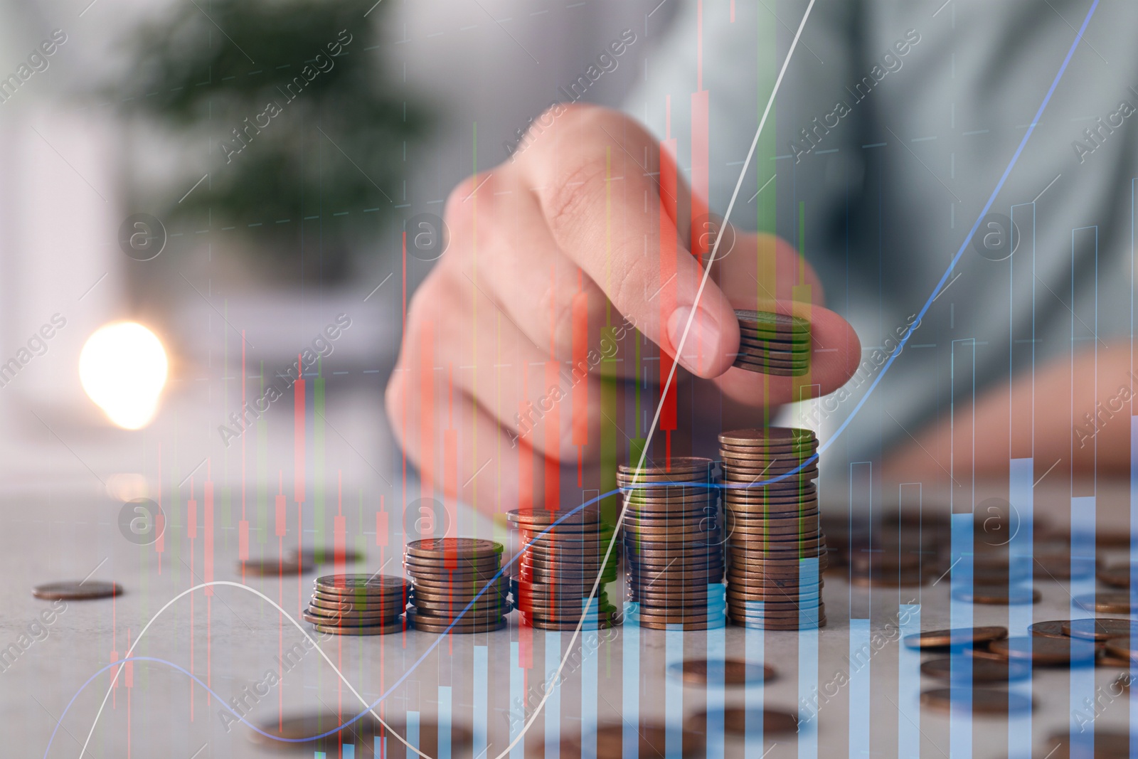 Image of Budget concept. Graphs and man stacking coins at table, double exposure