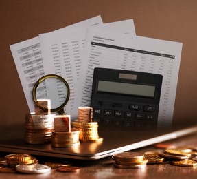 Image of Budget concept. Calculator, data, laptop and coins, double exposure