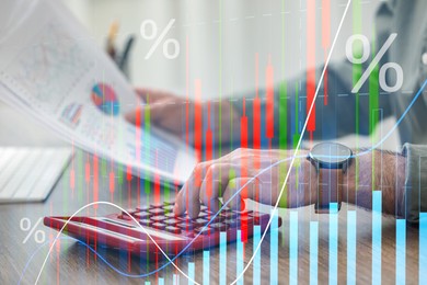 Budget concept. Graphs and man using calculator at table, double exposure