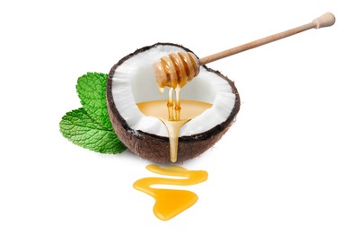 Image of Coconut and wooden dipper with honey isolated on white