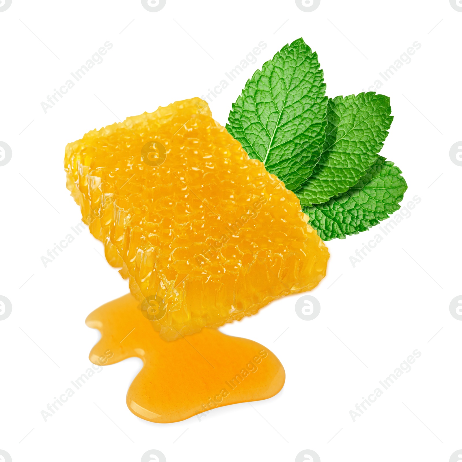 Image of Honeycomb with tasty honey and green leaves isolated on white