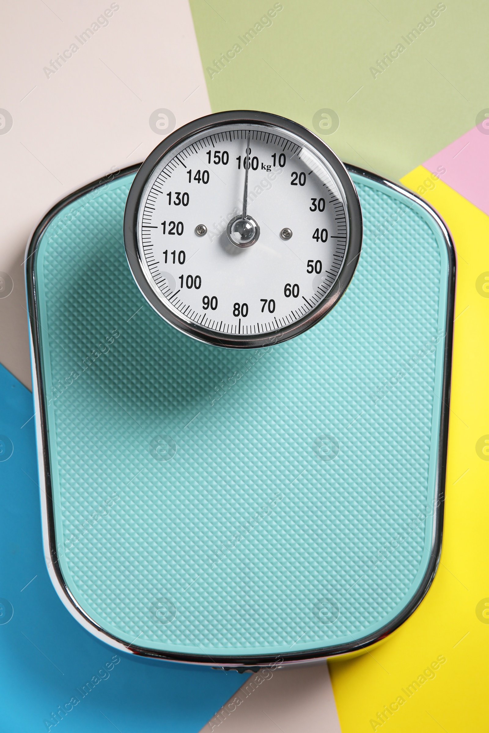 Photo of One bathroom scale on color background, top view