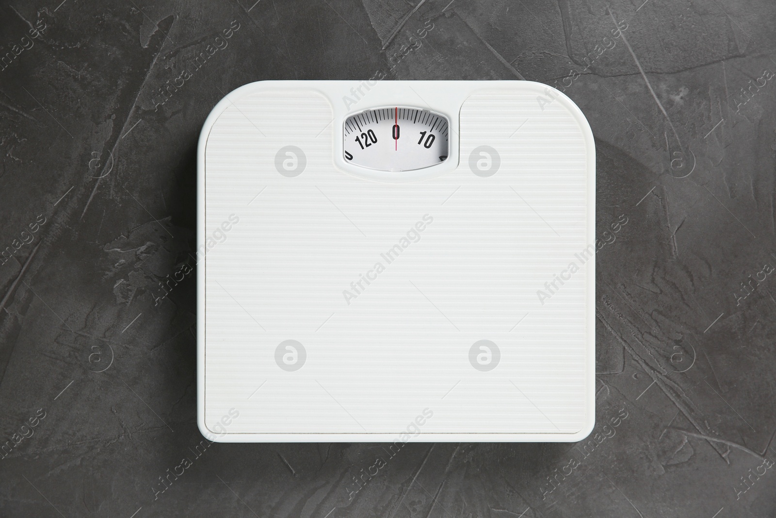 Photo of One bathroom scale on grey textured background, top view