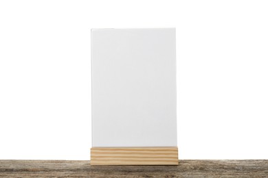 Photo of Menu holder on wooden table against white background. Mockup for design