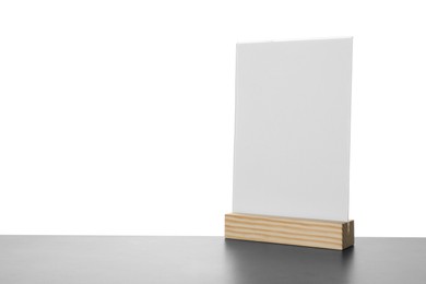 Menu holder on grey table against white background. Space for text