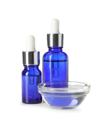 Photo of Bottles and bowl of chemical peel isolated on white. Peeling procedure