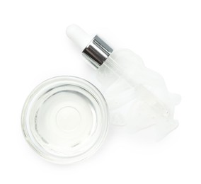 Pipette and bowl of chemical peel isolated on white, top view. Peeling procedure