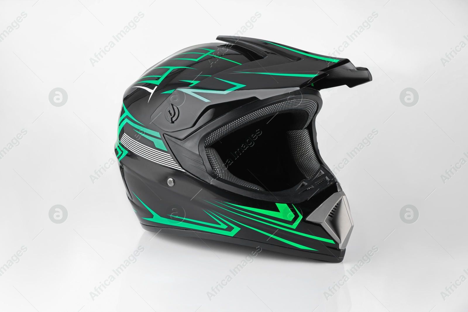 Photo of New stylish motorcycle helmet on white background