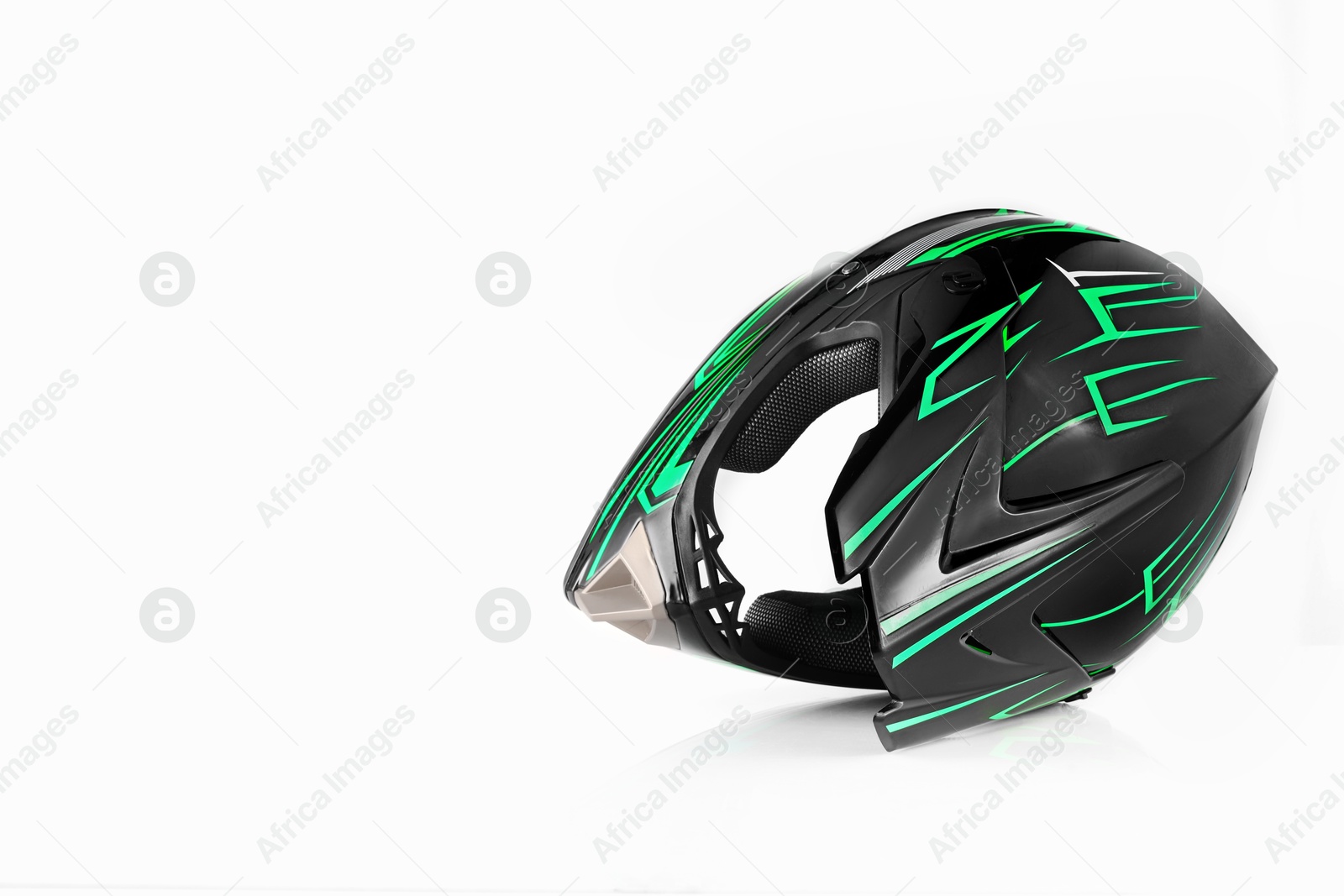 Photo of New stylish motorcycle helmet on white background, space for text