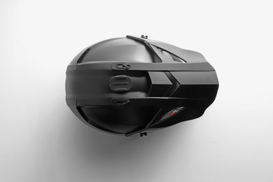 Photo of New stylish motorcycle helmet on white background, top view