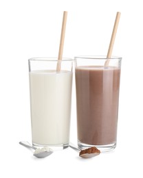 Photo of Delicious protein shakes in glasses and spoons with powder isolated on white