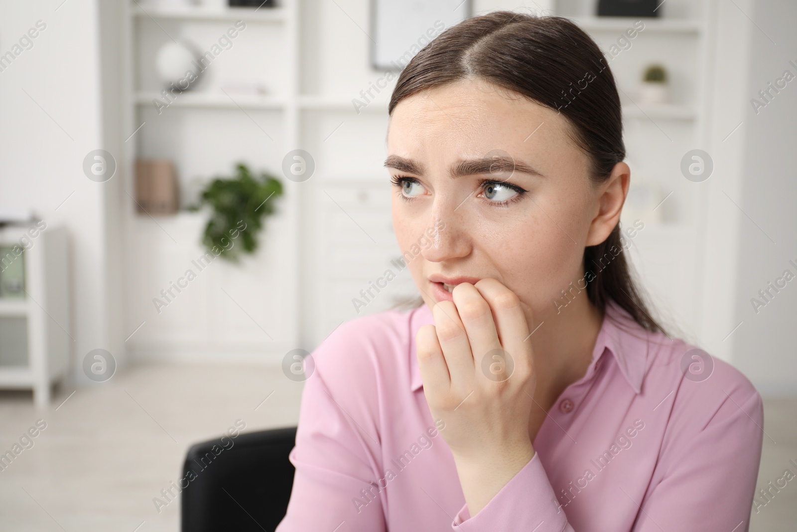 Photo of Portrait of embarrassed woman in office, space for text