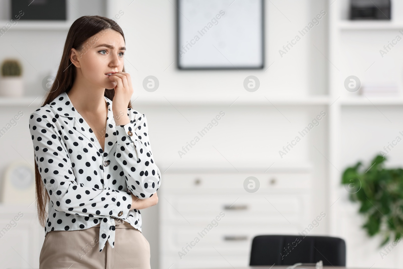 Photo of Embarrassed woman in office, space for text