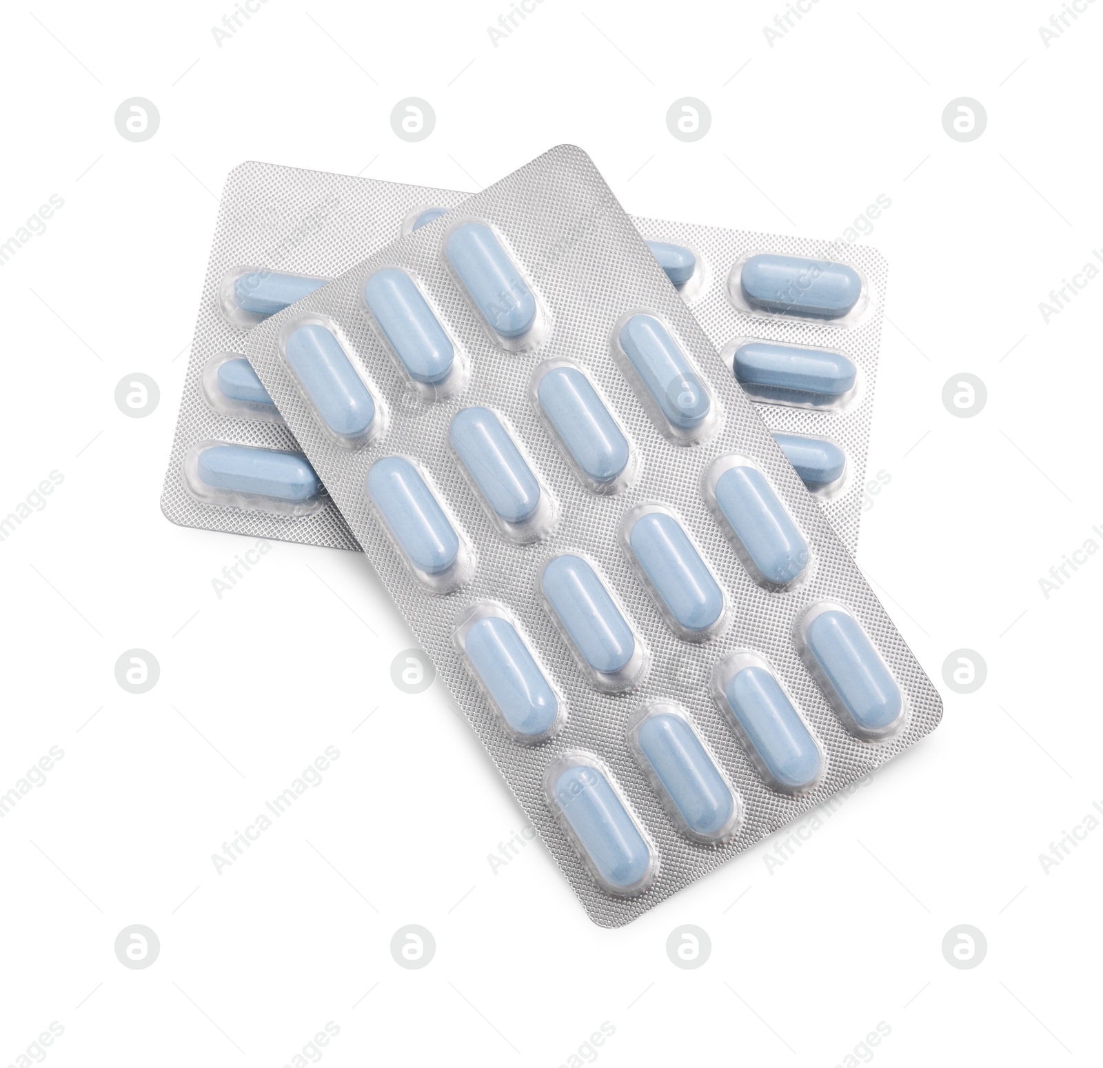 Photo of Antibiotic pills in blisters isolated on white, top view