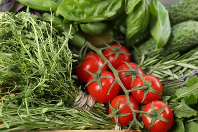 Photo of Different aromatic herbs and vegetables as background, closeup