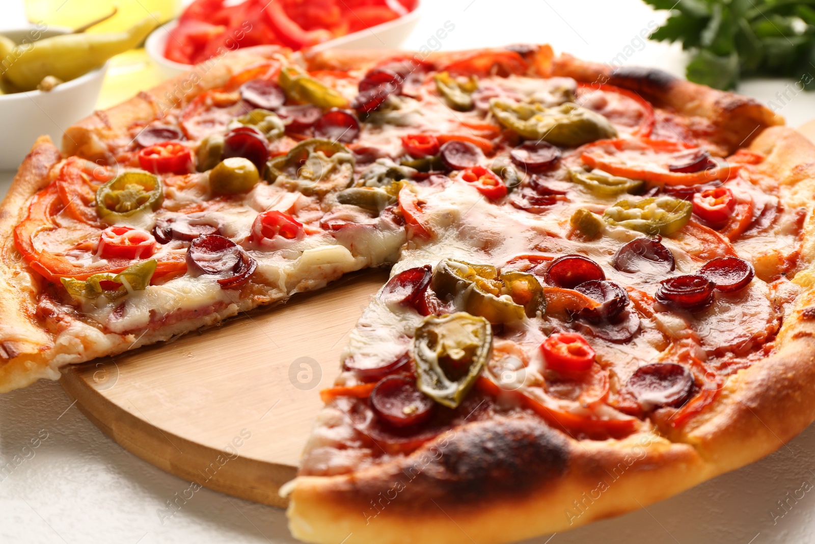 Photo of Delicious pizza Diablo on white textured table, closeup