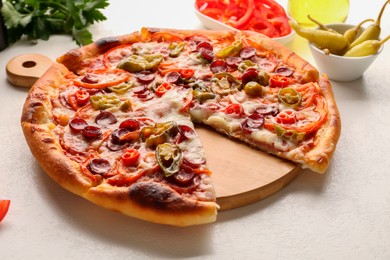 Photo of Delicious pizza Diablo on white textured table, closeup