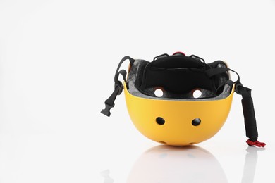 Photo of One yellow protective helmet on white background