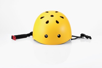 Photo of One yellow protective helmet on white background