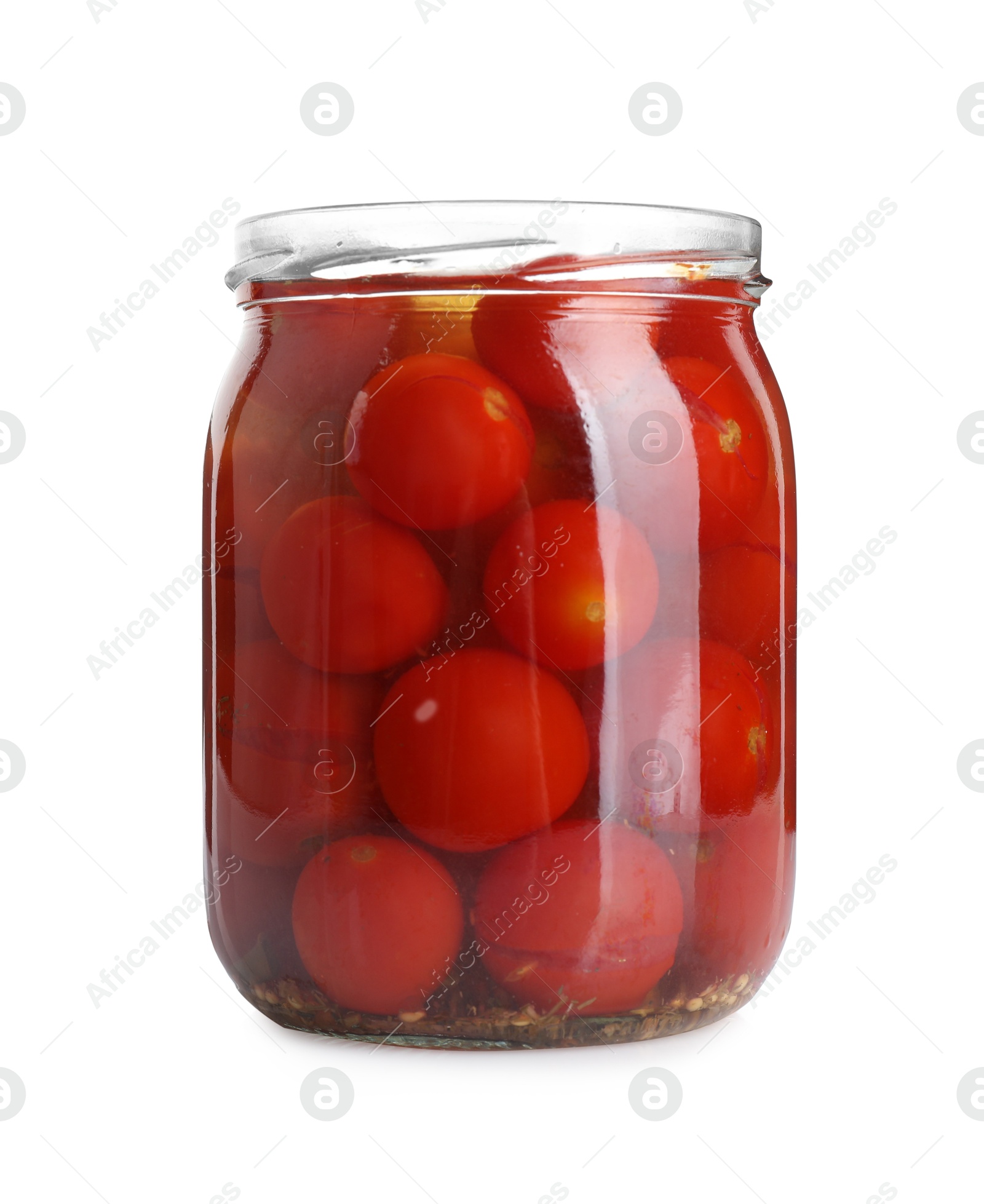 Photo of Tasty pickled tomatoes in jar isolated on white