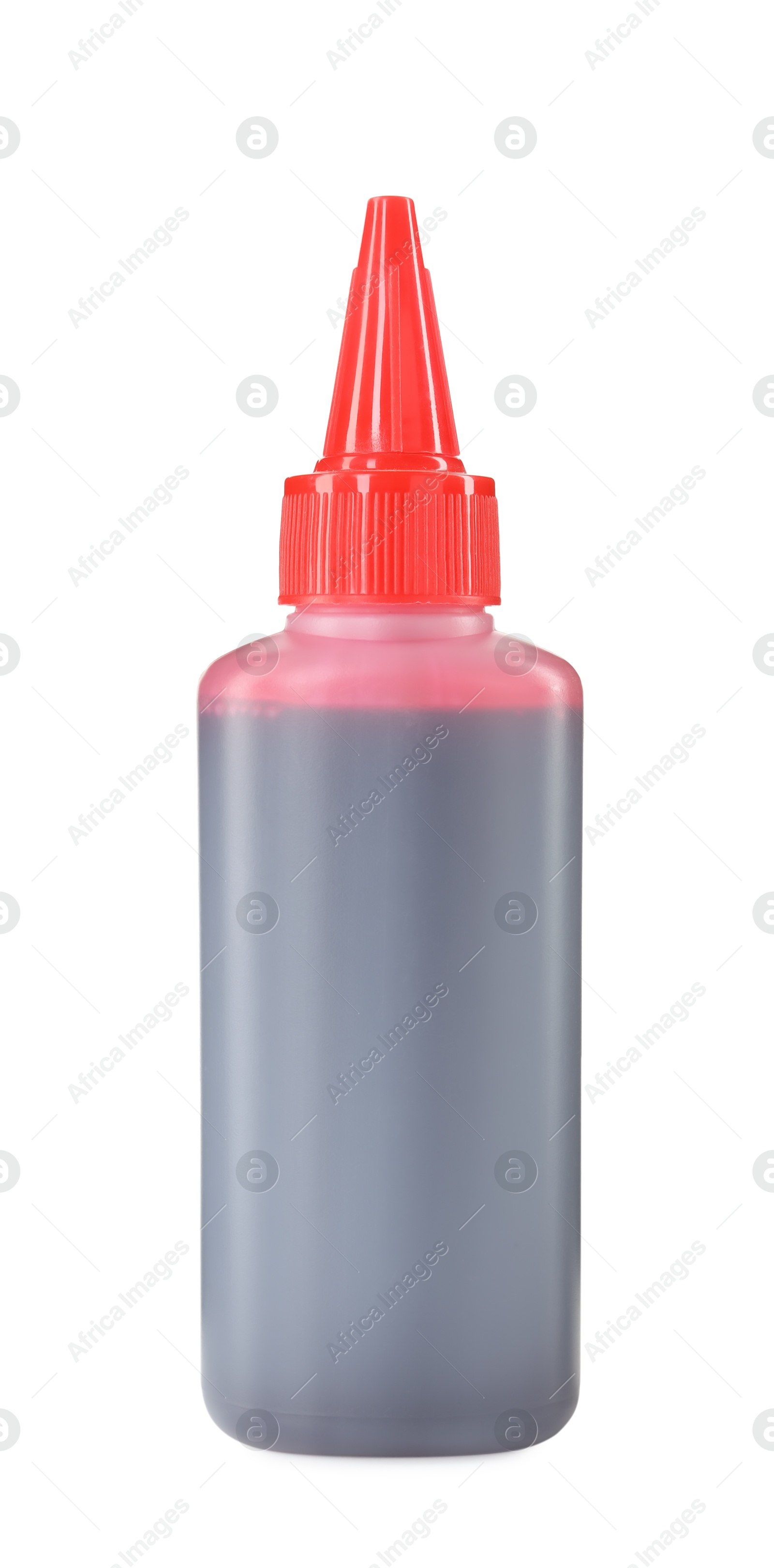 Photo of Bottle of red printer ink isolated on white