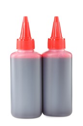 Photo of Bottle of red printer ink isolated on white