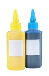 Photo of Bottles of different printer ink isolated on white