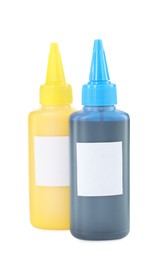 Photo of Bottles of different printer ink isolated on white