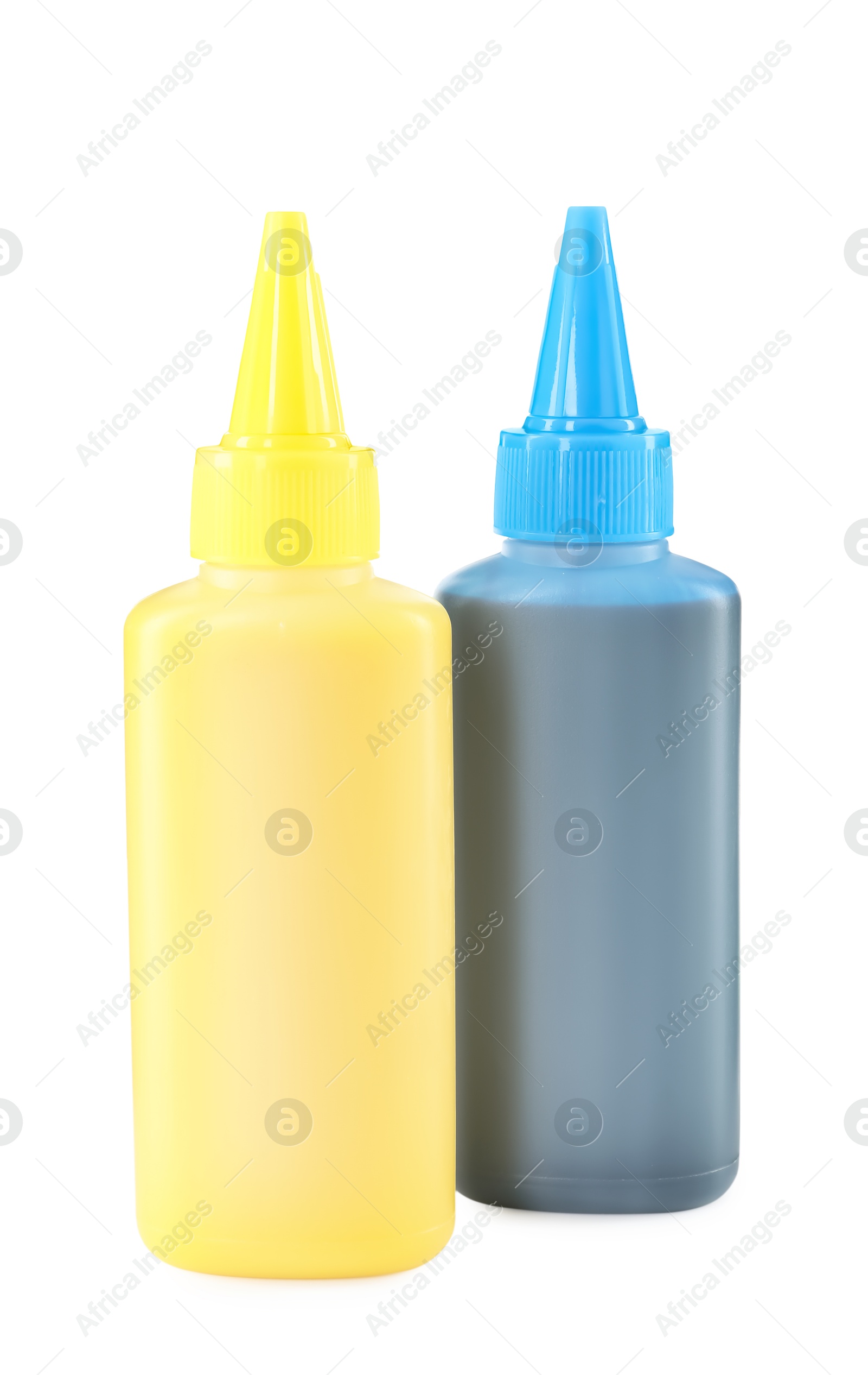 Photo of Bottles of different printer ink isolated on white