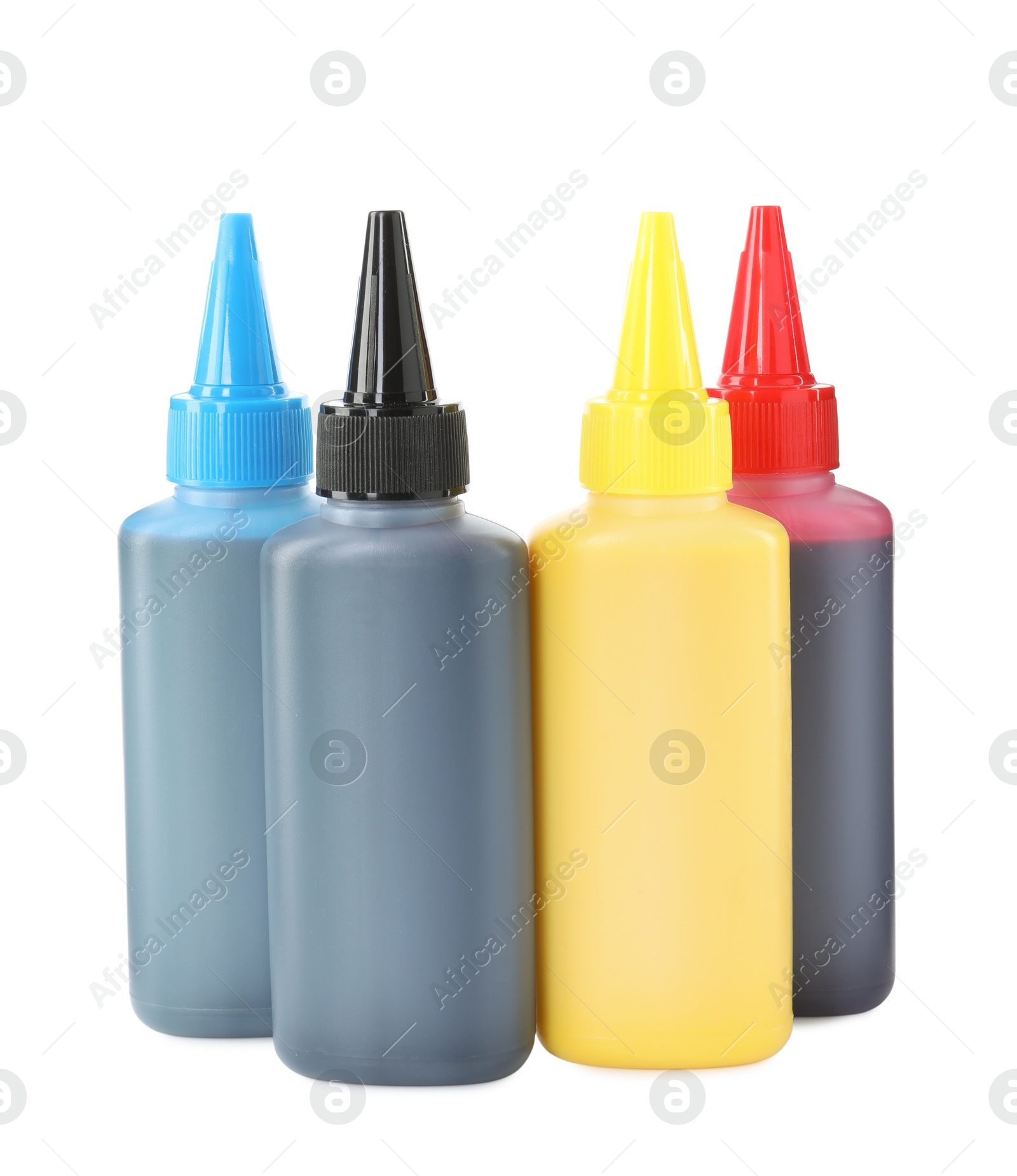 Photo of Bottles of different printer ink isolated on white