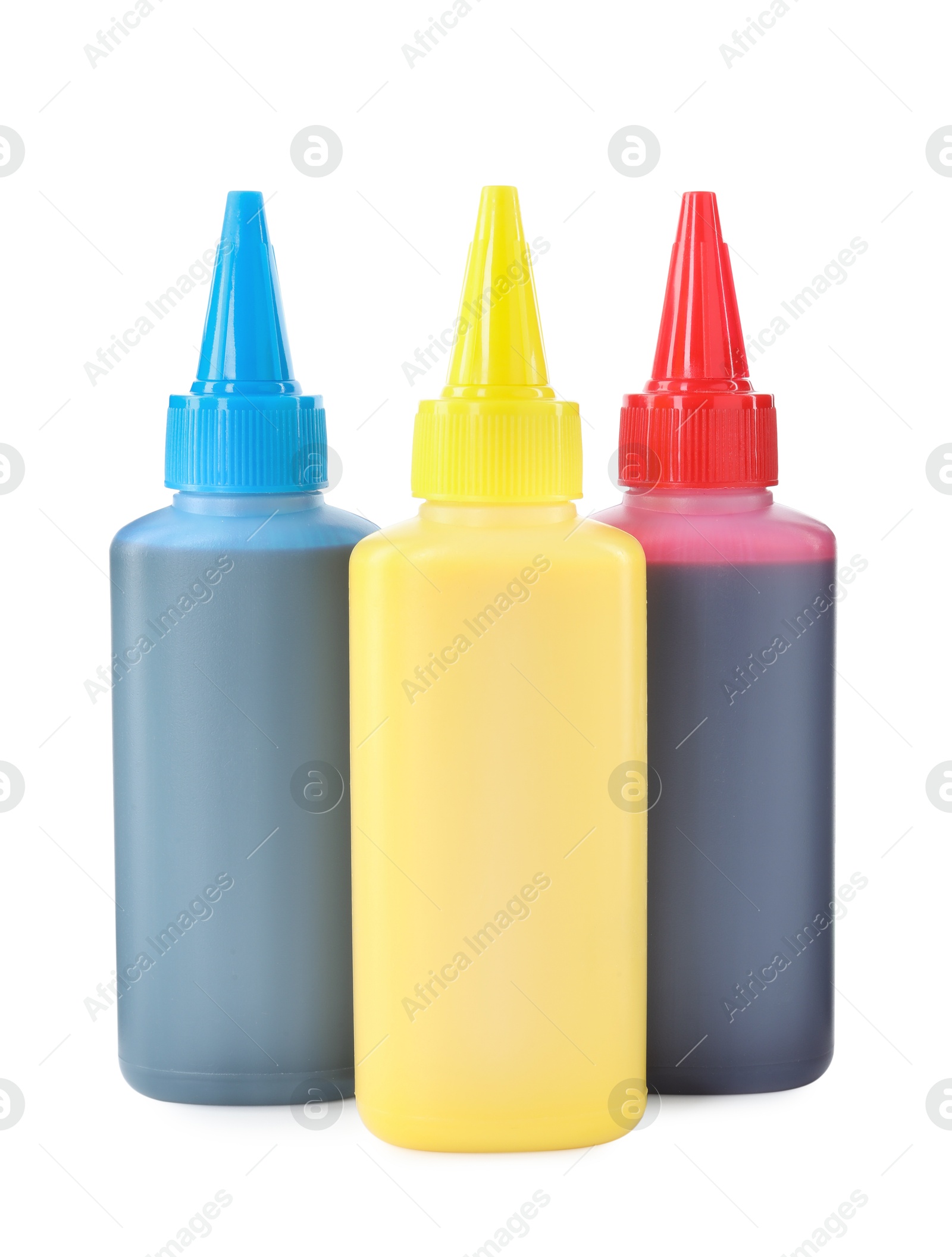 Photo of Bottles of different printer ink isolated on white