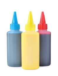 Photo of Bottles of different printer ink isolated on white