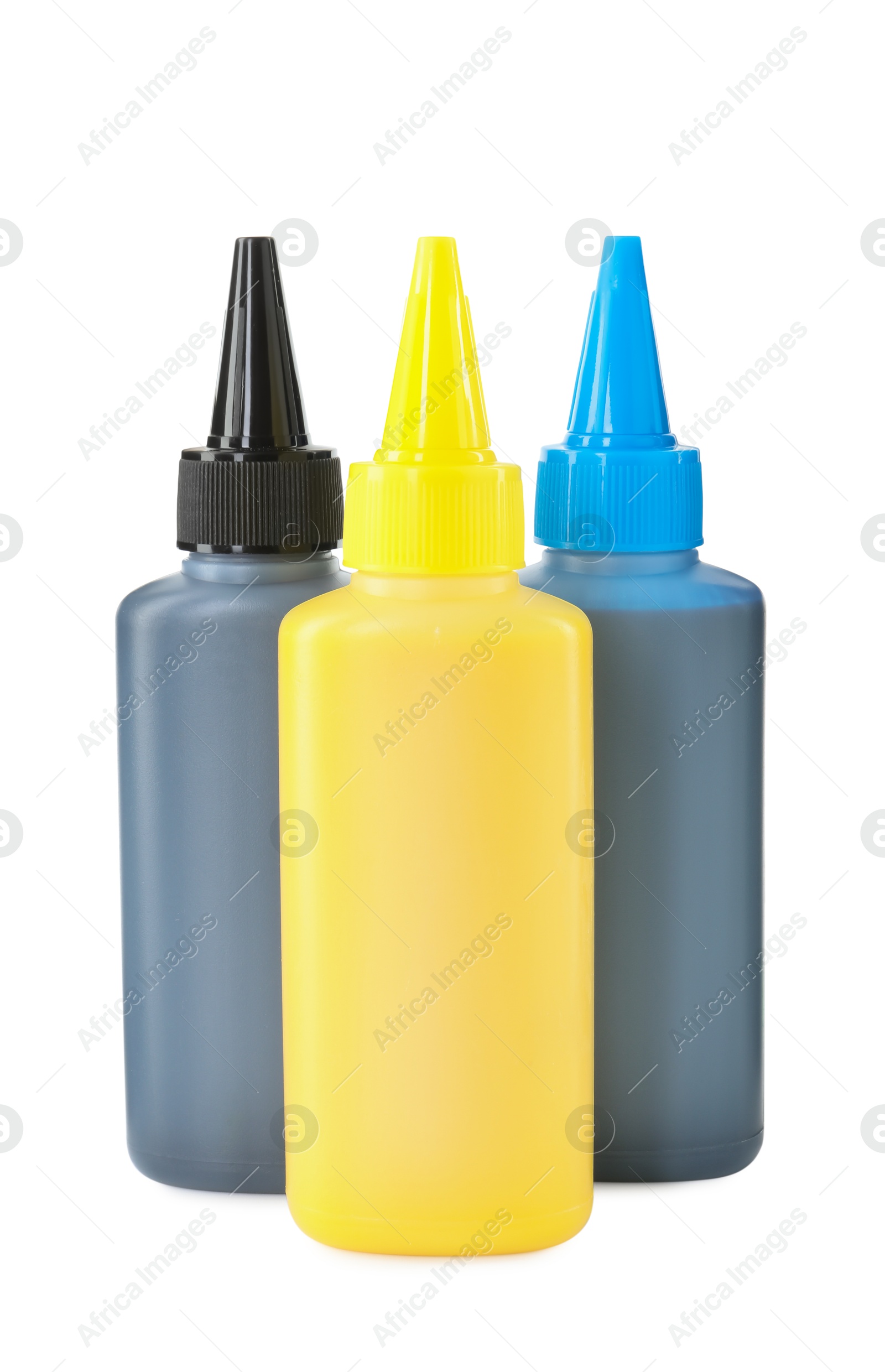 Photo of Bottles of different printer ink isolated on white