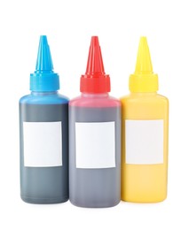 Photo of Bottles of different printer ink isolated on white