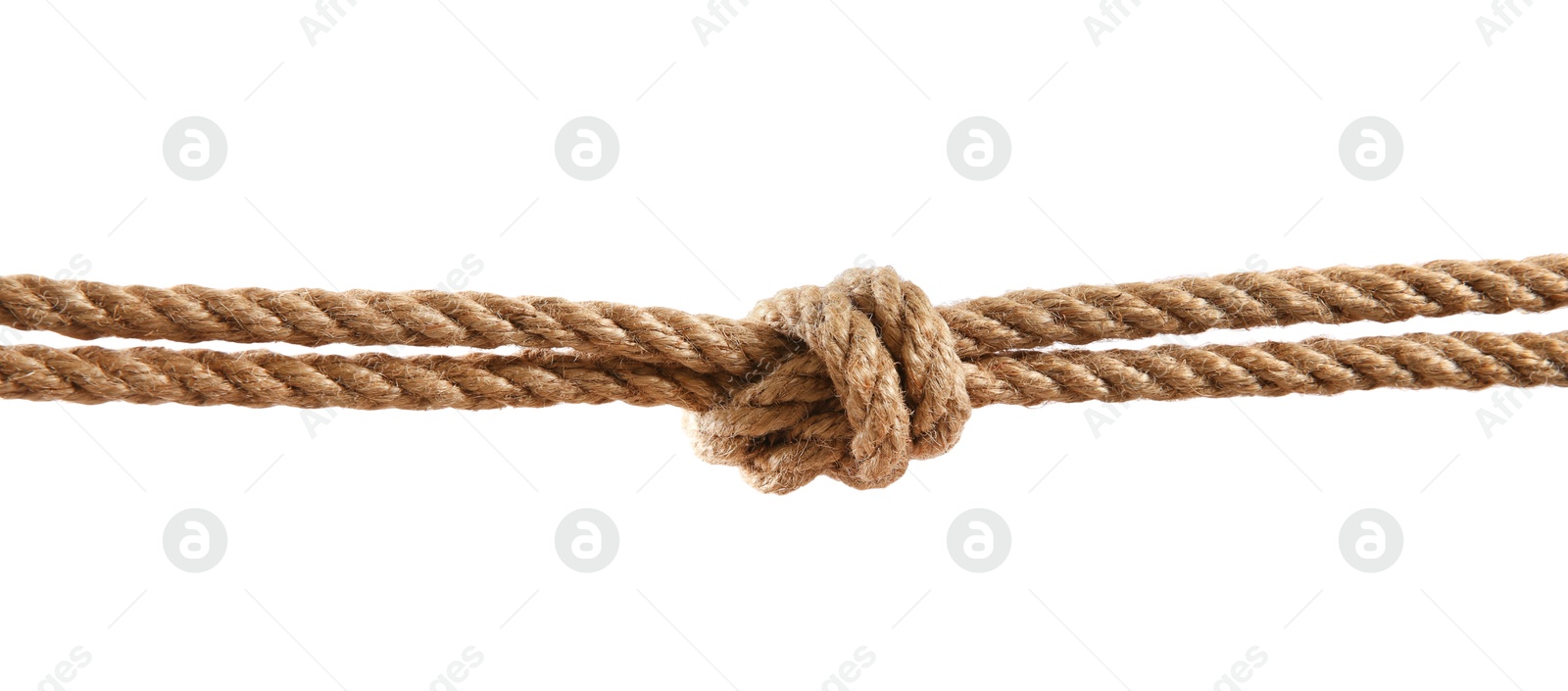 Photo of Hemp rope with knot on white background