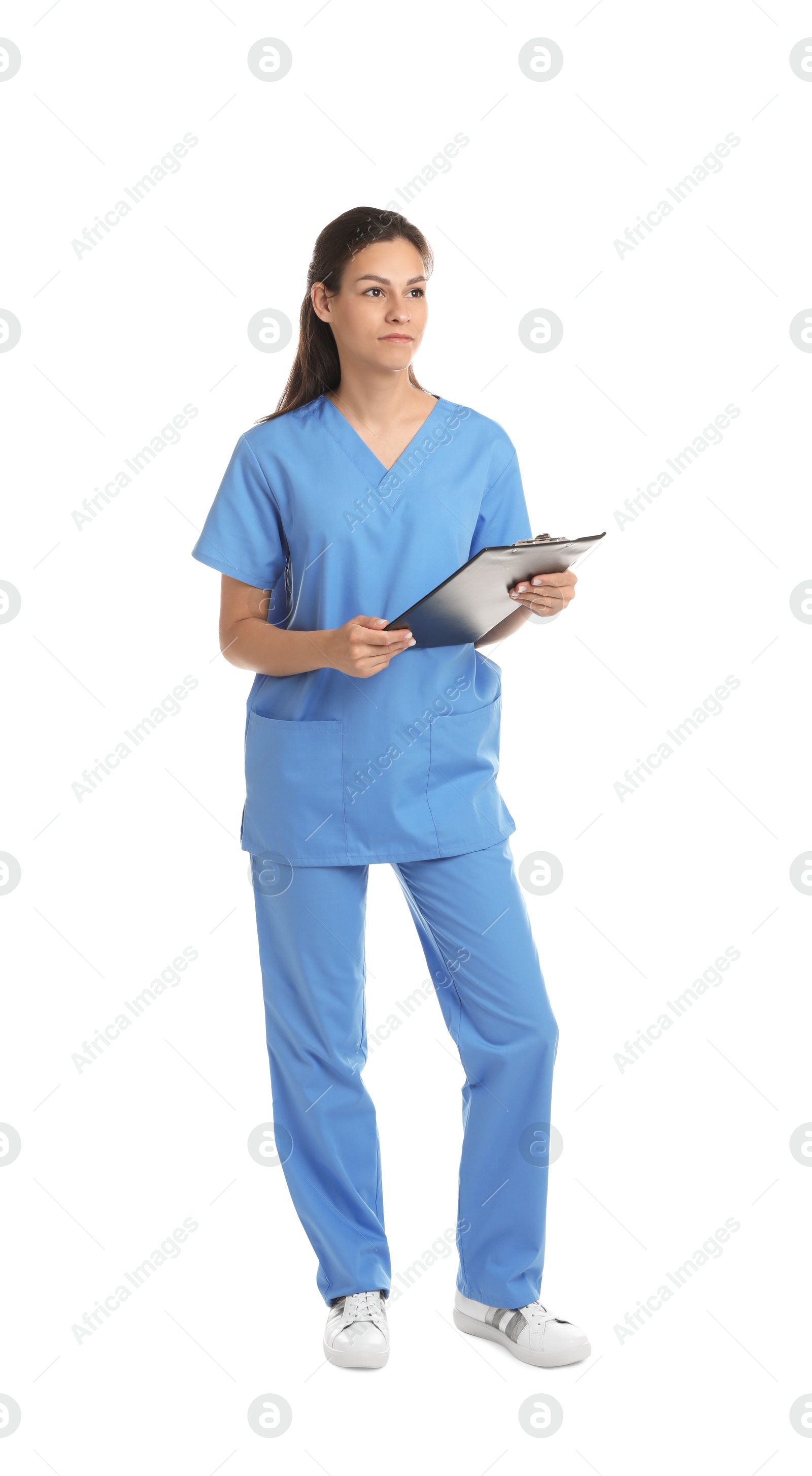 Photo of Beautiful nurse with clipboard on white background