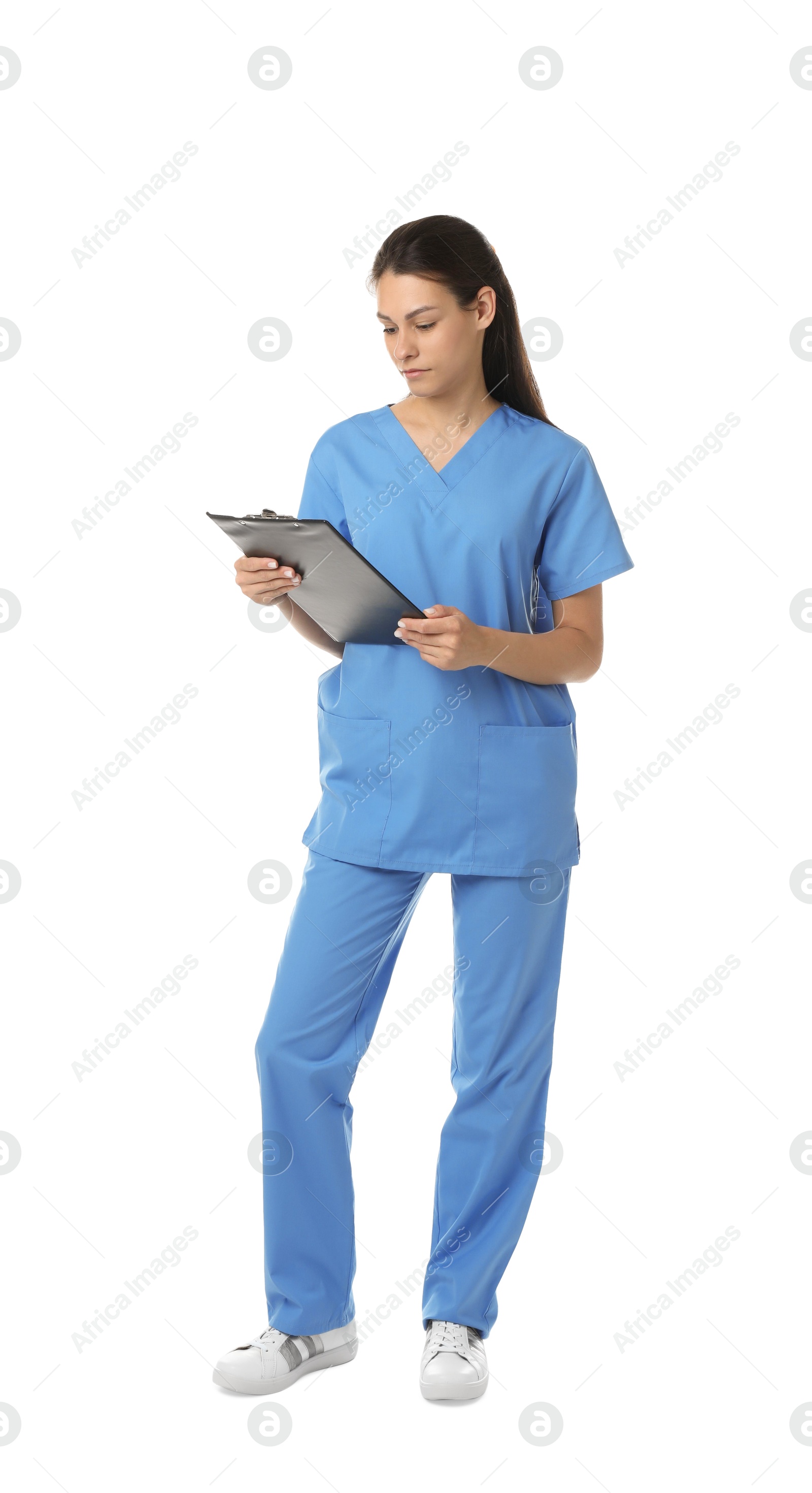 Photo of Beautiful nurse with clipboard on white background