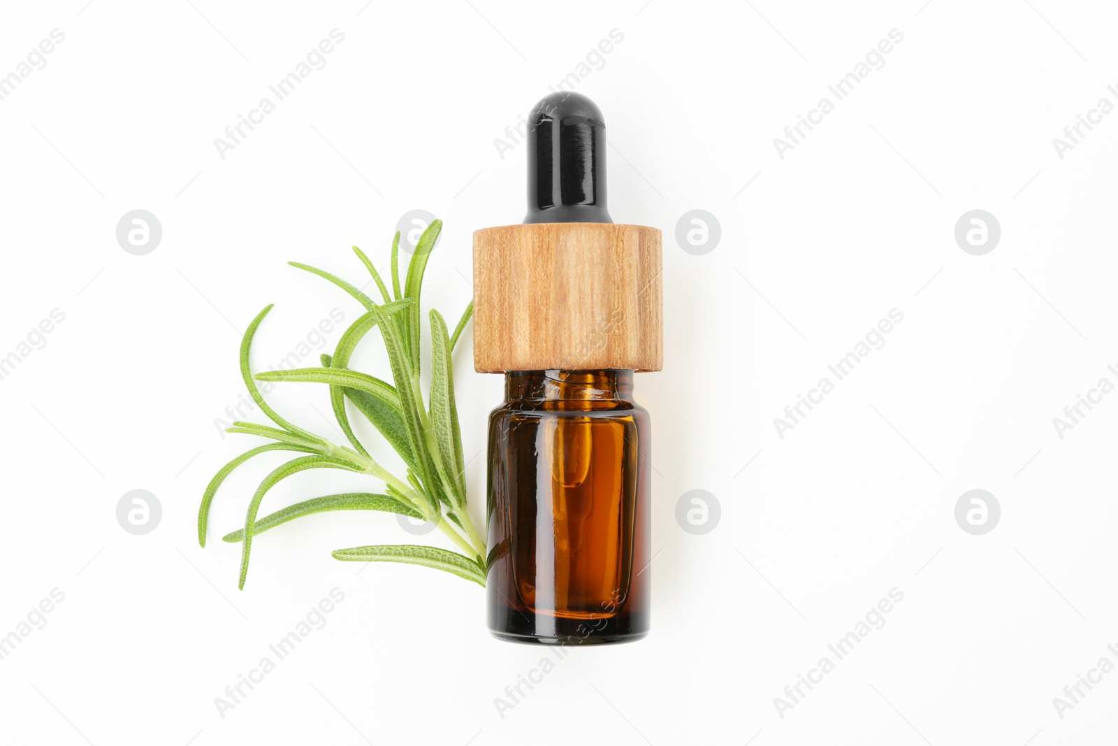 Photo of Aromatic essential oil in bottle and rosemary on white background, top view