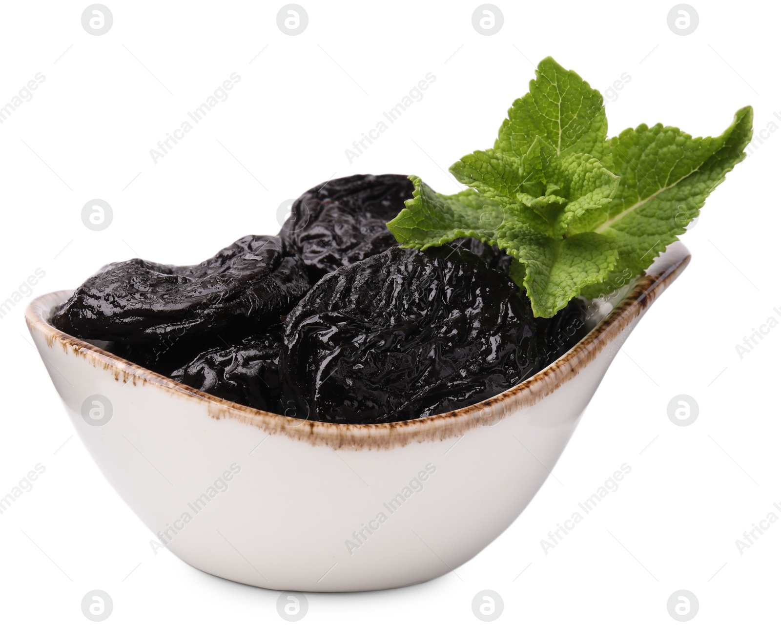 Photo of Tasty dried plums (prunes) and mint leaves on white background