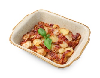 Photo of Delicious baked potatoes, bacon and basil in baking dish on white background